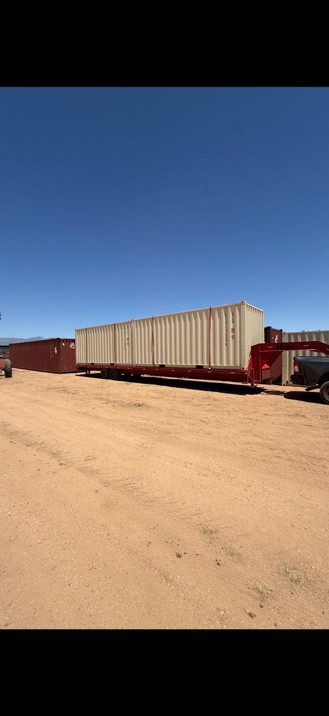 Two new 20-foot shipping container rentals loaded on a delivery trailer headed to a customer in Southern Arizona by Conex Creation & Supply.