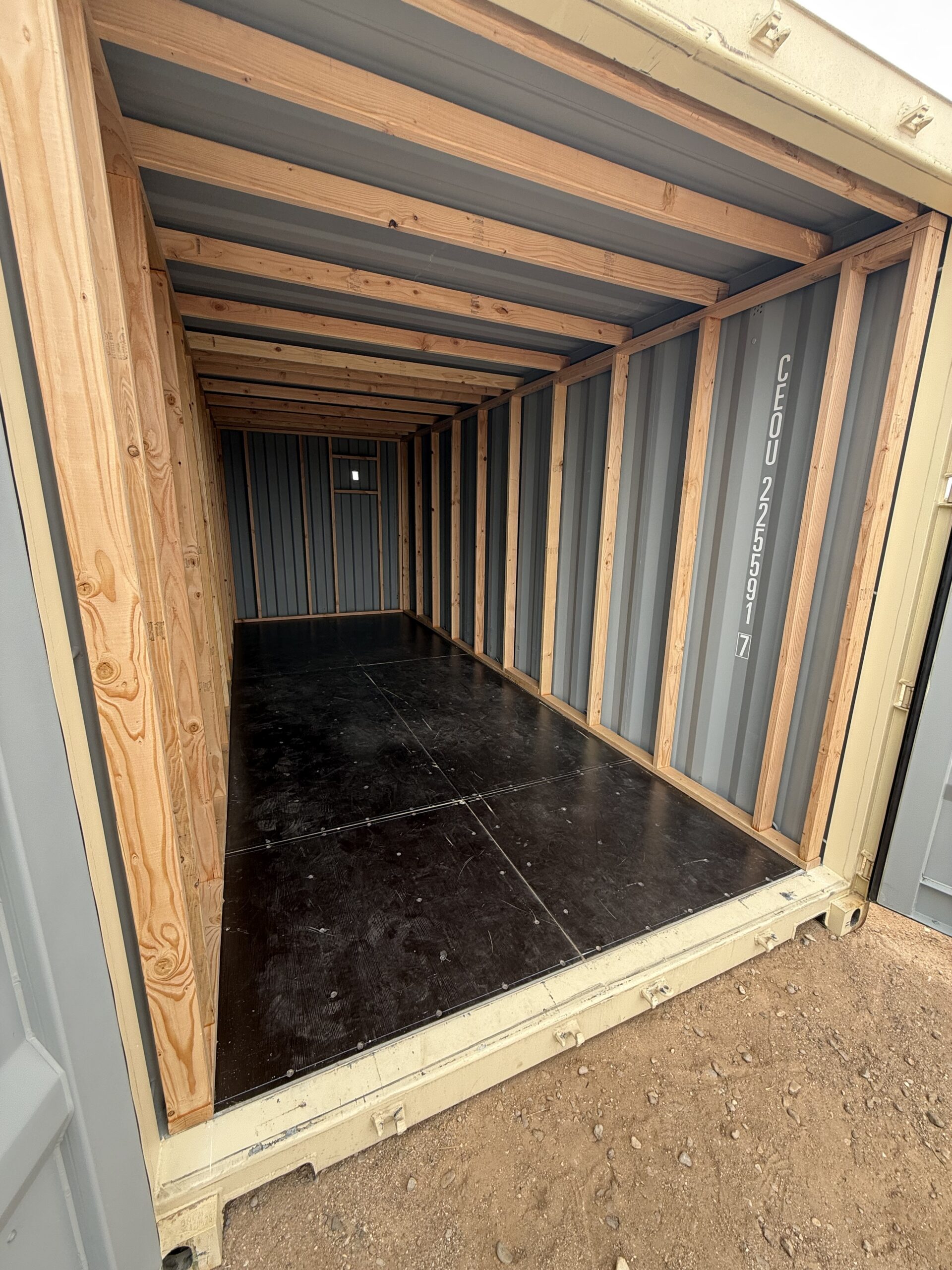 Interior framing inside a 20-foot shipping container being converted into a custom tack room for a Southern Arizona horse property by Conex Creation & Supply.