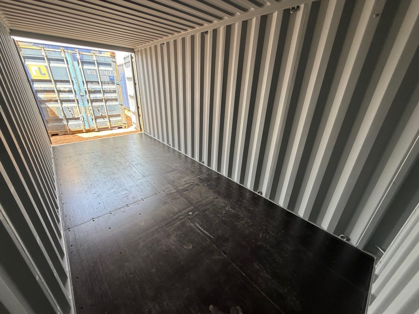 Clean interior of a new 20-foot one-trip shipping container suitable for mobile office builds and jobsite workspace conversions in Southern Arizona.