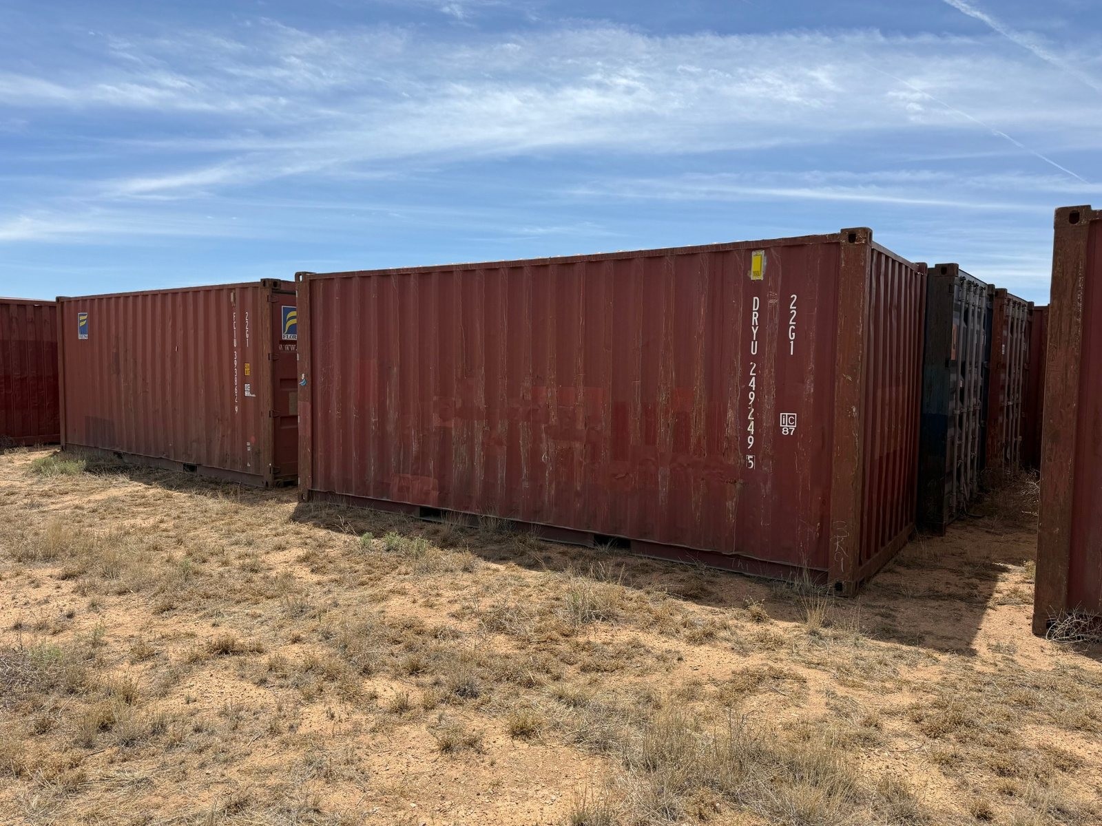Used 20-foot shipping container delivered to a Southern Arizona ranch property, suitable for a tack room or equipment storage.